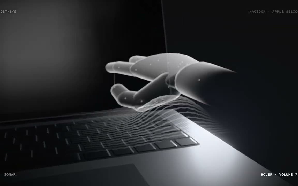 Ghostkeys film still: a translucent hand hovering above a MacBook keyboard while sonar ripples trace its movement